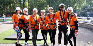 Group photo of Thomas Miller employees at a charity abseil
