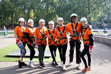 Group photo of Thomas Miller employees at a charity abseil